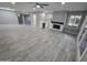 Open-concept living room with seamless flooring and modern ceiling fan at 10328 E Michigan Ave, Sun Lakes, AZ 85248