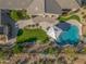 Aerial view highlighting a property with a pool, landscaped backyard, outdoor kitchen, and inviting patio at 10829 E Volterra Ct, Scottsdale, AZ 85262