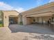 Spacious three car garage featuring epoxy floors and custom built-in cabinets at 10829 E Volterra Ct, Scottsdale, AZ 85262