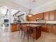 Spacious kitchen featuring granite countertops, custom cabinets, and stainless steel appliances at 10829 E Volterra Ct, Scottsdale, AZ 85262