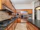 Kitchen featuring stainless steel appliances, granite countertops and custom cabinetry at 10829 E Volterra Ct, Scottsdale, AZ 85262