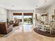 Bright open-concept living area with marble flooring, large windows, and desert views at 10829 E Volterra Ct, Scottsdale, AZ 85262