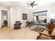 Spacious room with ceramic tile flooring, desk, and sliding doors leading to outdoor space at 10829 E Volterra Ct, Scottsdale, AZ 85262