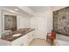 Elegant bathroom featuring double sinks, marble counters, and modern fixtures at 10960 N 78 St, Scottsdale, AZ 85260