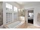 Bright bathroom with a soaking tub, glass block windows, and a separate glass shower at 10960 N 78 St, Scottsdale, AZ 85260