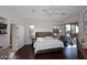 Cozy bedroom featuring a king-size bed, vaulted ceilings, a ceiling fan and access to the outdoor living area at 10960 N 78 St, Scottsdale, AZ 85260