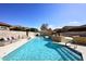 Sparkling community pool and lounge area with stylish outdoor furniture and well-manicured landscaping at 10960 N 78 St, Scottsdale, AZ 85260