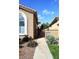 Charming front entrance featuring well-maintained landscaping, a paved walkway, and an inviting exterior at 10960 N 78 St, Scottsdale, AZ 85260