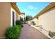 Beautiful home featuring a courtyard with mature trees and plants, creating a serene outdoor space at 10960 N 78 St, Scottsdale, AZ 85260