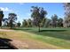 Beautiful golf course view with lush green grass, mature trees, and blue skies enhancing the property's appeal at 10960 N 78 St, Scottsdale, AZ 85260