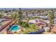 Aerial view of a private backyard featuring a sparkling pool, mature trees, and a spacious patio at 1205 W El Prado Rd, Chandler, AZ 85224