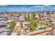 A stunning aerial view of a backyard showcasing a gazebo and a sparkling pool surrounded by lush landscaping at 1205 W El Prado Rd, Chandler, AZ 85224