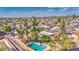 An aerial shot showcases the pool, surrounded by homes in the quiet neighborhood at 1205 W El Prado Rd, Chandler, AZ 85224