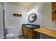 Bright bathroom featuring a single vanity, mirror, and custom wooden details at 1205 W El Prado Rd, Chandler, AZ 85224