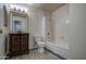 Cozy bathroom featuring a single vanity and a shower-tub combo at 1205 W El Prado Rd, Chandler, AZ 85224