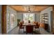 Elegant dining room features a wood ceiling, exposed beams, and a large window view at 1205 W El Prado Rd, Chandler, AZ 85224