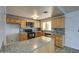 Efficient kitchen featuring an island, decorative backsplash, stainless appliances, light wood cabinets at 1205 W El Prado Rd, Chandler, AZ 85224