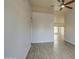 Spacious room featuring wood-look tile and an open layout at 1205 W El Prado Rd, Chandler, AZ 85224