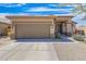 Charming single-Gathering home with a two-car garage, desert landscaping, and a welcoming covered entryway at 13216 S 175 Dr, Goodyear, AZ 85338