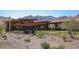 A luxurious modern house nestled against a backdrop of majestic mountains at 13216 S 175 Dr, Goodyear, AZ 85338