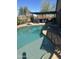 Inviting backyard pool with an outdoor kitchen and a covered dining area, perfect for entertaining at 13216 S 175 Dr, Goodyear, AZ 85338