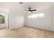 Bright bedroom featuring wood-look flooring, a ceiling fan, and natural light from multiple windows at 13244 N 54Th Dr, Glendale, AZ 85304