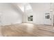 Bright entryway featuring wood flooring, high ceilings, and a modern door at 13244 N 54Th Dr, Glendale, AZ 85304