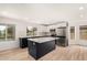 Modern kitchen with navy-blue cabinets, white countertops, and stainless steel appliances, bright natural light at 13244 N 54Th Dr, Glendale, AZ 85304