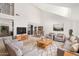 Spacious living room is styled with modern furniture, wood flooring, and natural light at 13244 N 54Th Dr, Glendale, AZ 85304