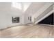 Bright entryway featuring wood flooring, high ceilings, and a modern staircase at 13244 N 54Th Dr, Glendale, AZ 85304