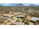 Expansive aerial view showcasing a desert home with horse property at 1345 E Gaffney Rd, New River, AZ 85087