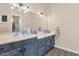 Bathroom with dual sinks, plenty of counter space, and tasteful vanity lighting at 1345 E Gaffney Rd, New River, AZ 85087