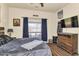 Cozy bedroom featuring a large window, and dark wood accents at 1345 E Gaffney Rd, New River, AZ 85087