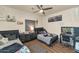 Charming bedroom featuring wood floors, ceiling fan, two beds, and a stylish vanity at 1345 E Gaffney Rd, New River, AZ 85087