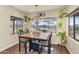 Bright dining area with a mountain view, modern lighting, and charming botanical decor at 1345 E Gaffney Rd, New River, AZ 85087