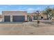 Modern home exterior with two-car garage and landscaped entry at 1345 E Gaffney Rd, New River, AZ 85087