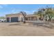 Beautiful desert home boasts an attractive entryway and a convenient two-car garage at 1345 E Gaffney Rd, New River, AZ 85087