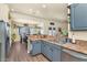 Open kitchen view into dining area features nice countertops and stainless steel sink at 1345 E Gaffney Rd, New River, AZ 85087