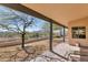 Inviting covered patio with beautiful desert landscape views, perfect for outdoor living at 1345 E Gaffney Rd, New River, AZ 85087