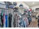 Spacious walk-in closet with ample shelving and hanging storage for clothing and accessories at 1345 E Gaffney Rd, New River, AZ 85087