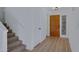 Entryway boasting wood floors, neutral tones, and access to a carpeted staircase at 13824 S 41St Way, Phoenix, AZ 85044