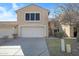 Two-story townhome featuring a two-car garage and well-maintained landscaping at 13824 S 41St Way, Phoenix, AZ 85044