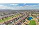 Bird's-eye view of a neighborhood adjacent to a golf course, highway and local shopping centers at 13942 W Summerstar Dr, Sun City West, AZ 85375