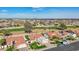 Aerial view of the home showcasing the tile roof, landscaping, and golf course view at 13942 W Summerstar Dr, Sun City West, AZ 85375