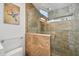 Beautiful bathroom featuring tile finishes, glass enclosed shower and modern fixtures at 13942 W Summerstar Dr, Sun City West, AZ 85375