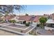 An elevated angle displays a well-kept home, xeriscaping, and an inviting outdoor patio area at 13942 W Summerstar Dr, Sun City West, AZ 85375