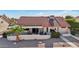 Aerial view of a well-maintained home showcasing a tile roof and a cozy outdoor living space at 13942 W Summerstar Dr, Sun City West, AZ 85375