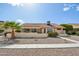 Charming single-story home with red tile roof, desert landscaping, and a sunny patio at 13942 W Summerstar Dr, Sun City West, AZ 85375