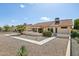 A single-Gathering home features a stucco exterior, red tile roof, desert landscaping, and a covered patio area at 13942 W Summerstar Dr, Sun City West, AZ 85375