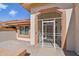 Close up of entrance with security gate with desert landscaping and brick walkway at 13942 W Summerstar Dr, Sun City West, AZ 85375